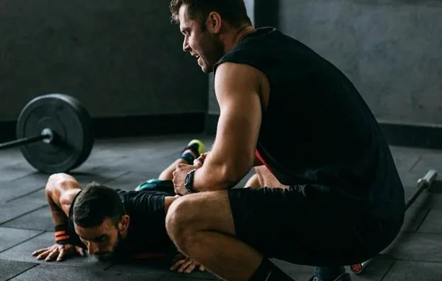 Two men working out at the gym